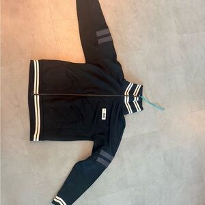 Puma x Rhude Rare Collaboration Piece. Black Zip-Up Jacket with White Stripes